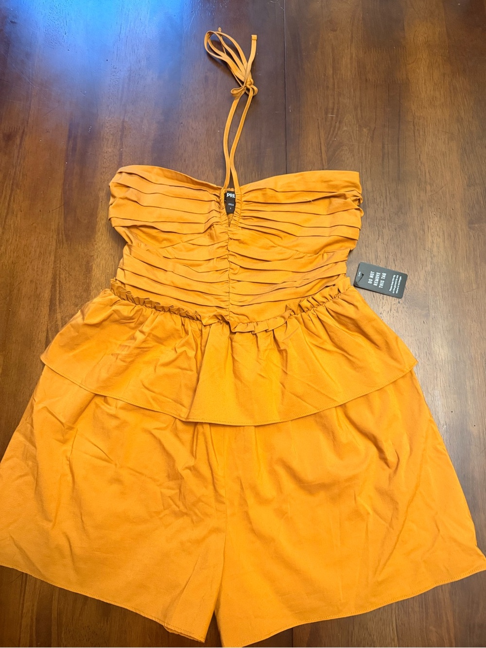 Express Strapless Tiered Ruffle Romper in Orange